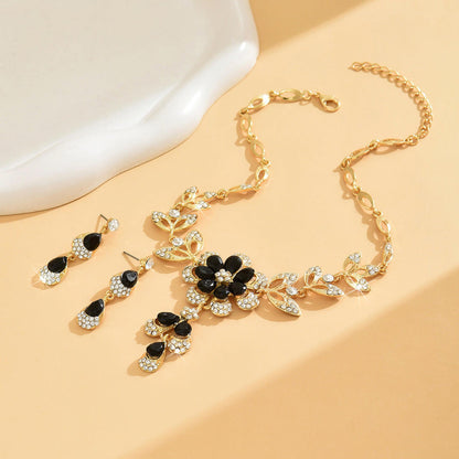 Parure Élégance Noire : Cristal Floral & Finition Dorée